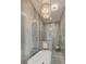 Spa-like bathroom with freestanding tub, walk-in shower, and elegant gray tile walls at 1714 Middle St, Sullivans Island, SC 29482