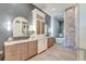 Spacious bathroom showcasing dual vanities, custom cabinetry, and a luxurious soaking tub at 1714 Middle St, Sullivans Island, SC 29482
