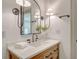 Stylish bathroom vanity with a vessel sink, quartz countertop, and decorative lighting fixtures at 1714 Middle St, Sullivans Island, SC 29482