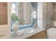 Bathroom vanity with marble countertop, decorative accents and framed mirror at 1714 Middle St, Sullivans Island, SC 29482