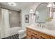 Well-lit bathroom with patterned tile, vanity with drawers, and shower-tub combo at 1714 Middle St, Sullivans Island, SC 29482