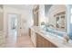 Bright bathroom showcasing marble countertops, custom cabinetry, and stylish decor at 1714 Middle St, Sullivans Island, SC 29482