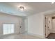 Bright, minimalist bedroom with light wood floors and an en suite bathroom at 1714 Middle St, Sullivans Island, SC 29482