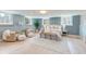 Serene bedroom features light blue walls, hardwood floors, and large windows for natural light at 1714 Middle St, Sullivans Island, SC 29482