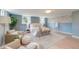 Well-lit bedroom with neutral tones features an accent wall, wood floors, and modern furnishings at 1714 Middle St, Sullivans Island, SC 29482