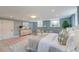 Spacious bedroom featuring hardwood floors, recessed lighting, and soft decor and large area rug at 1714 Middle St, Sullivans Island, SC 29482