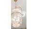 Close-up of an antique-style chandelier with a hanging chain and ornate design at 1714 Middle St, Sullivans Island, SC 29482