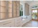 Custom walk-in closet with built-in shelves, drawers, and window seat at 1714 Middle St, Sullivans Island, SC 29482