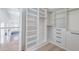 Spacious walk-in closet with custom shelving, drawers, and ample storage space at 1714 Middle St, Sullivans Island, SC 29482