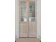 Stylish glass paneled wooden doors leading from hall at 1714 Middle St, Sullivans Island, SC 29482