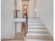 Bright, inviting entryway features hardwood floors, striking staircase and contemporary lighting at 1714 Middle St, Sullivans Island, SC 29482