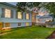 Exterior view of a home with lots of windows and a verdant green lawn at 1714 Middle St, Sullivans Island, SC 29482