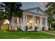 Stately home with a classic design, mature trees and a manicured lawn at 1714 Middle St, Sullivans Island, SC 29482