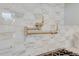 A gold pot filler faucet against a white marble geometric tile backsplash complements the upscale kitchen design at 1714 Middle St, Sullivans Island, SC 29482