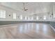 Bright great room featuring hardwood floors, decorative ceiling tiles, and ample natural light at 1714 Middle St, Sullivans Island, SC 29482