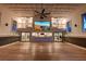 Expansive great room with high ceilings, wood floors, exposed brick, and a large screen at 1714 Middle St, Sullivans Island, SC 29482