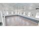 Expansive great room with hardwood floors, high ceilings, and numerous windows for natural light at 1714 Middle St, Sullivans Island, SC 29482