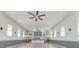 Bright open great room showcasing hardwood floors, classic tin ceilings, and plenty of natural light from surrounding windows at 1714 Middle St, Sullivans Island, SC 29482