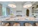 Elegant kitchen with marble countertop, island seating, and modern appliances at 1714 Middle St, Sullivans Island, SC 29482