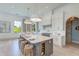 Spacious kitchen featuring a marble island with seating and modern lighting at 1714 Middle St, Sullivans Island, SC 29482