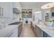 Bright kitchen with marble counters, farmhouse sink, and professional grade appliances at 1714 Middle St, Sullivans Island, SC 29482