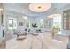 Bright, open-concept kitchen and living area with a marble island, modern lighting, and stylish decor at 1714 Middle St, Sullivans Island, SC 29482