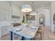 Large island with marble countertop, seating, and modern lighting at 1714 Middle St, Sullivans Island, SC 29482