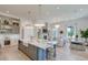 Open-concept living space with a gourmet kitchen, cozy seating area, and inviting dining nook at 1714 Middle St, Sullivans Island, SC 29482