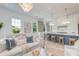Open-concept living area with a stylish kitchen, comfortable seating, and a dining area flooded with natural light at 1714 Middle St, Sullivans Island, SC 29482