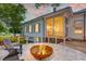 Inviting outdoor space featuring a fire pit, comfortable seating, and a charming screened-in porch at 1714 Middle St, Sullivans Island, SC 29482