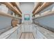 Beautiful walk-in pantry with custom cabinetry, marble countertops, open shelving and hardwood floors at 1714 Middle St, Sullivans Island, SC 29482