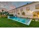 Backyard pool at dusk with a serene setting and lush landscaping at 1714 Middle St, Sullivans Island, SC 29482