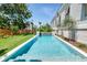 A stylish modern pool showcasing crystal clear water, and clean, bright tile construction at 1714 Middle St, Sullivans Island, SC 29482