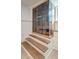 Basement sauna featuring glass front, wooden steps, and stylish cabinetry at 1714 Middle St, Sullivans Island, SC 29482