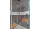 Luxury shower with mosaic tile, built-in seating, shower head, and sleek fixtures at 1714 Middle St, Sullivans Island, SC 29482