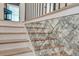 Unique staircase design with decorative mirrored wall tiles and natural wood steps at 1714 Middle St, Sullivans Island, SC 29482