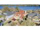 Stunning waterfront home features a red tile roof, lush landscaping, and ample parking at 1739 Indigo Island Dr, Hanahan, SC 29410