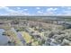 Scenic aerial view of a beautiful neighborhood near the water and lush trees under a partly cloudy blue sky at 1739 Indigo Island Dr, Hanahan, SC 29410