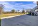 Spacious backyard featuring a large grassy lawn with a concrete patio and stairs leading up to a deck at 1739 Indigo Island Dr, Hanahan, SC 29410