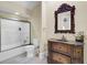 Bathroom featuring single sink vanity with ornate mirror and a shower behind a sliding glass door at 1739 Indigo Island Dr, Hanahan, SC 29410