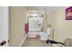 Bright bathroom featuring a white shower, toilet, beige tile flooring and colorful wall art at 1739 Indigo Island Dr, Hanahan, SC 29410