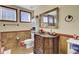 A stylish bathroom vanity with a decorative mirror and sink, complemented by traditional tiles and decor at 1739 Indigo Island Dr, Hanahan, SC 29410