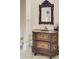 Bathroom featuring a single sink vanity with ornate mirror and a shower behind a glass door at 1739 Indigo Island Dr, Hanahan, SC 29410