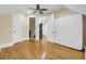 This bedroom features hardwood floors, ceiling fan, access to other rooms, and neutral colored walls at 1739 Indigo Island Dr, Hanahan, SC 29410