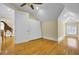 Bedroom with hardwood floors, ceiling fan, and a view of another room with a giraffe statue at 1739 Indigo Island Dr, Hanahan, SC 29410