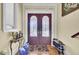 Inviting foyer with double doors, parquet floors, and shoe storage for organization at 1739 Indigo Island Dr, Hanahan, SC 29410