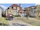 Stately home features a terracotta roof, manicured lawn, and multiple vehicles in the driveway at 1739 Indigo Island Dr, Hanahan, SC 29410