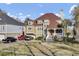 Elegant home with a terracotta roof, well-maintained landscaping, and convenient driveway parking at 1739 Indigo Island Dr, Hanahan, SC 29410