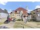Beautifully landscaped traditional home features a terracotta roof and a charming front porch at 1739 Indigo Island Dr, Hanahan, SC 29410