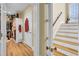 A hallway featuring a view of the staircase and a walk-in closet, highlighting the home's layout and storage solutions at 1739 Indigo Island Dr, Hanahan, SC 29410